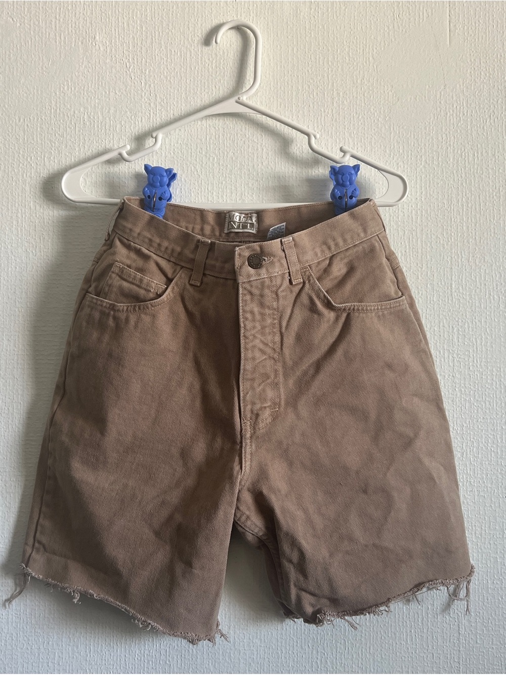 vintage tan/brown denim shorts, cutoffs with raw frayed edge, high waist